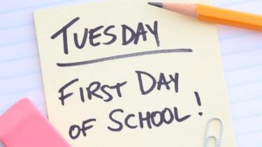 yellow sticky note that says Tuesday, first day of school
