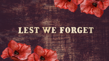 Lest we forget sign with red poppy's