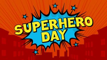 superhero day sign with a red background