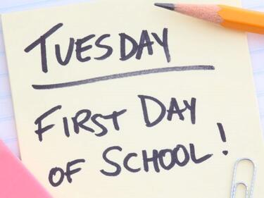 yellow sticky note that says Tuesday, first day of school