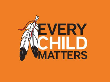 every child matters on an orange background