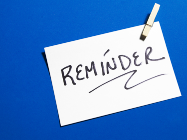 blue background with a white sign that says reminder