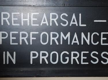 rehearsal in progress sign