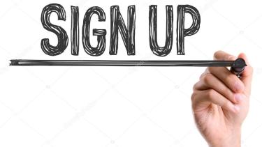 sign up written in a black sharpie pen