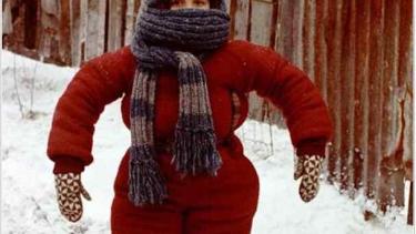 boy dressed in snowsuit 